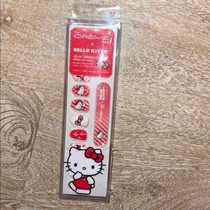 The Crème shop x Hello Kitty press on nails with glue.